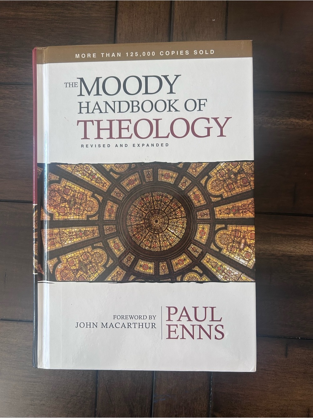 The Moody Handbook of Theology by Paul Enns - White and Maroon Cover